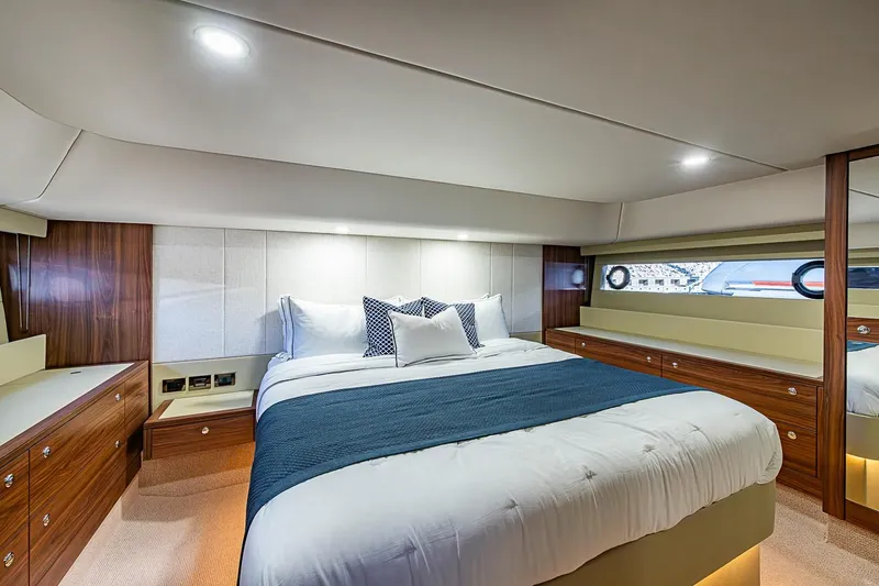 Slide: The Image of Luxurious bedroom interior of 2026 Maritimo M50 yacht with elegant wood finishes. - 56