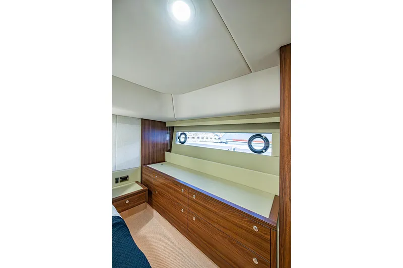 Slide: The Image of Luxurious interior of 2026 Maritimo M50 yacht with sleek wood cabinetry and modern design. - 60