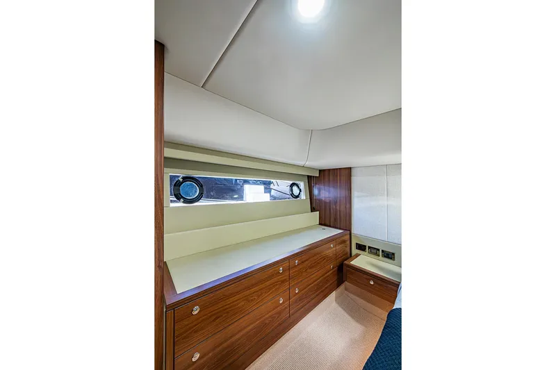 Slide: The Image of Luxurious interior of 2026 Maritimo M50 yacht with wood accents and modern amenities. - 61