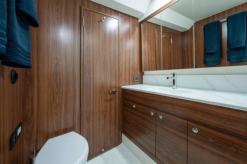Slide: The Image of Luxurious bathroom in 2026 Maritimo M50 yacht with wood cabinetry and modern fixtures. - 64