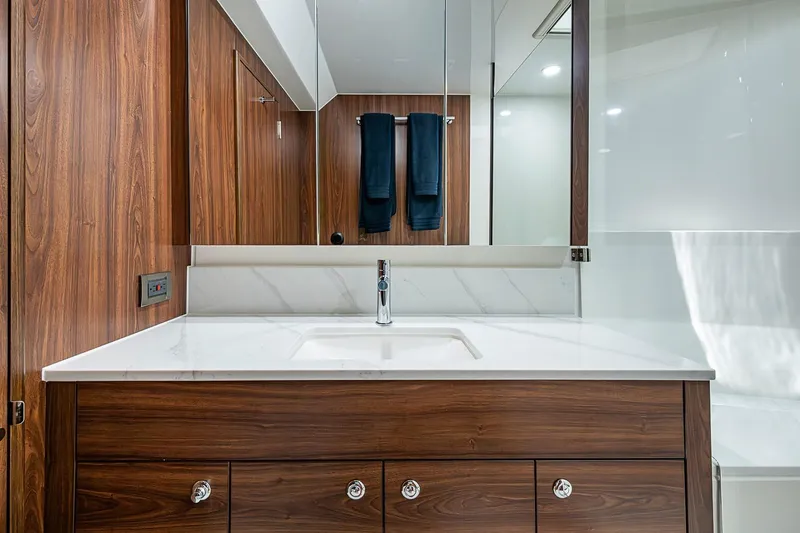 Slide: The Image of Luxurious Maritimo M50 2026 yacht bathroom with wood accents and modern fixtures. - 65