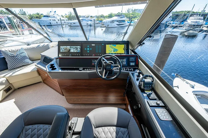 Slide: The Image of Luxurious 2026 Maritimo M50 yacht helm with advanced navigation systems and waterfront view. - 74