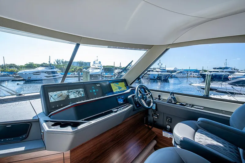 Slide: The Image of Interior view of 2026 Maritimo M50 yacht cockpit with marina in background. - 75