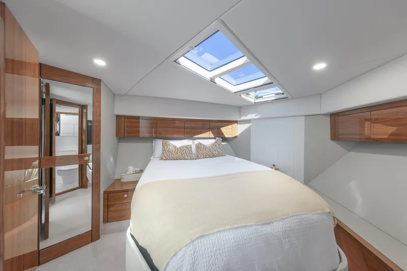 Slide: The Image of Luxurious cabin interior of 2026 Maritimo M50 yacht with skylight and elegant wood finishes. - 8