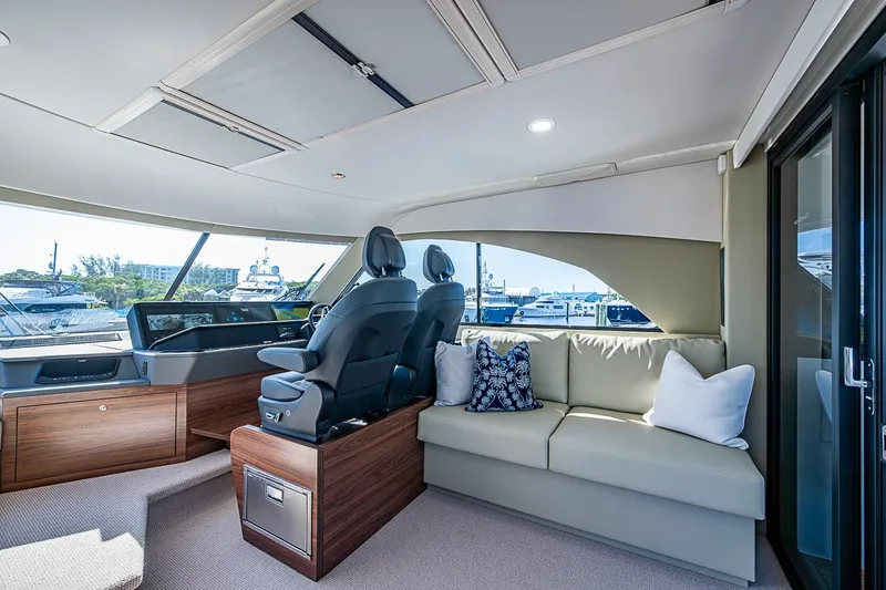Slide: The Image of Luxurious interior of 2026 Maritimo M50 yacht with plush seating and modern helm. - 80
