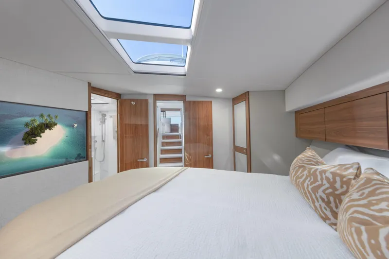 Slide: The Image of Luxurious interior of 2026 Maritimo M50 yacht with skylight and elegant wood finishes. - 9