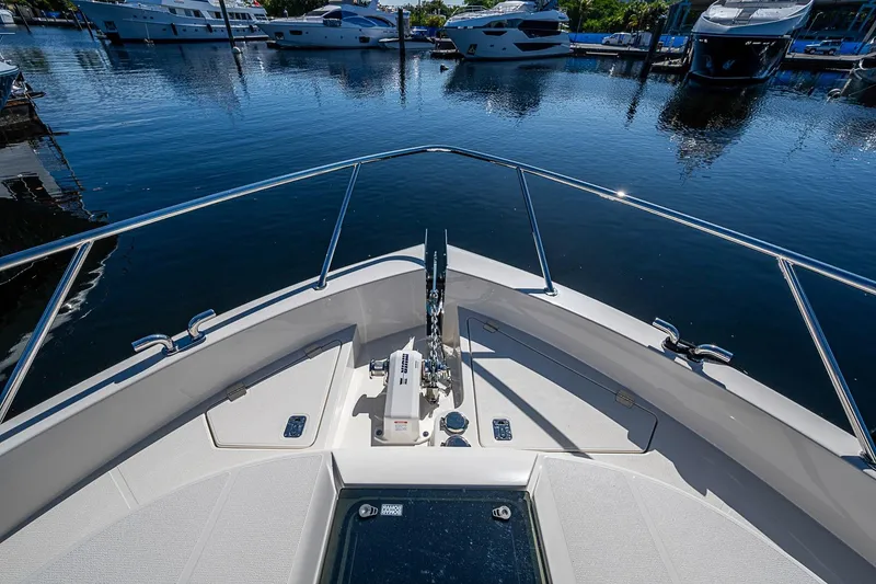 Slide: The Image of Bow view of 2026 Maritimo M50 yacht docked in a marina. - 90