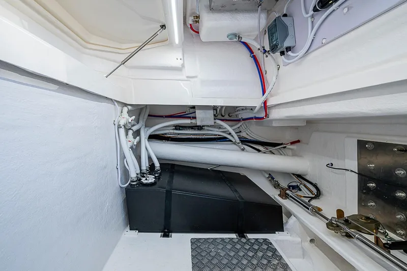 Slide: The Image of Engine room of 2026 Maritimo M50 yacht, showcasing pipes and electrical components. - 97