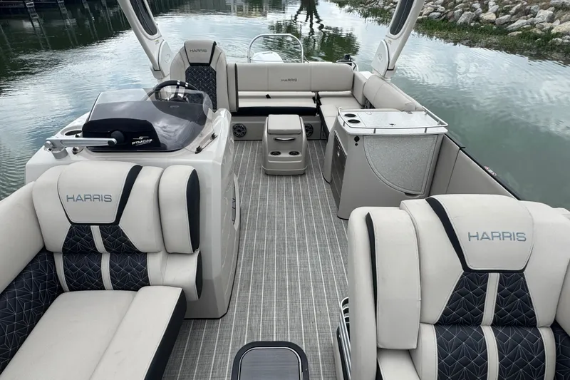 Slide: The Image of 2023 Harris Grand Mariner 250 boat interior with luxurious seating and modern amenities. - 11