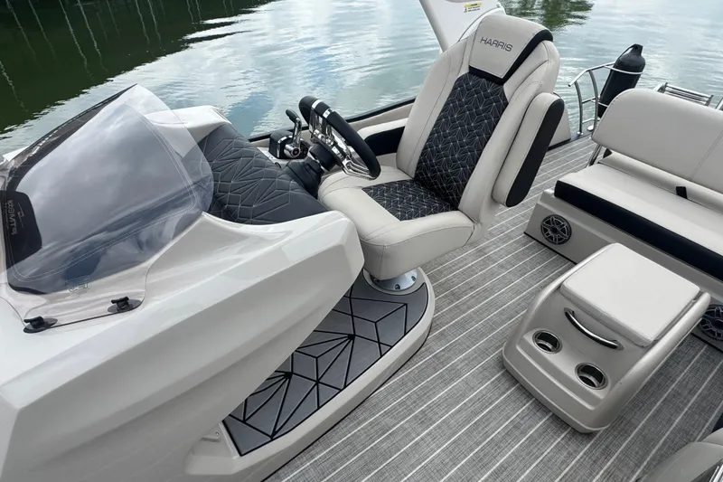 Slide: The Image of 2023 Harris Grand Mariner 250 boat interior with luxury seating and modern dashboard design. - 15