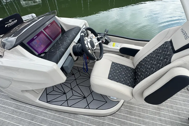 Slide: The Image of 2023 Harris Grand Mariner 250 helm with modern dashboard and luxurious seating. - 16