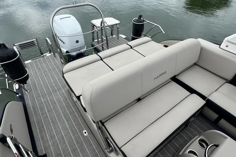 Slide: The Image of 2023 Harris Grand Mariner 250 pontoon boat with spacious seating and modern design. - 22