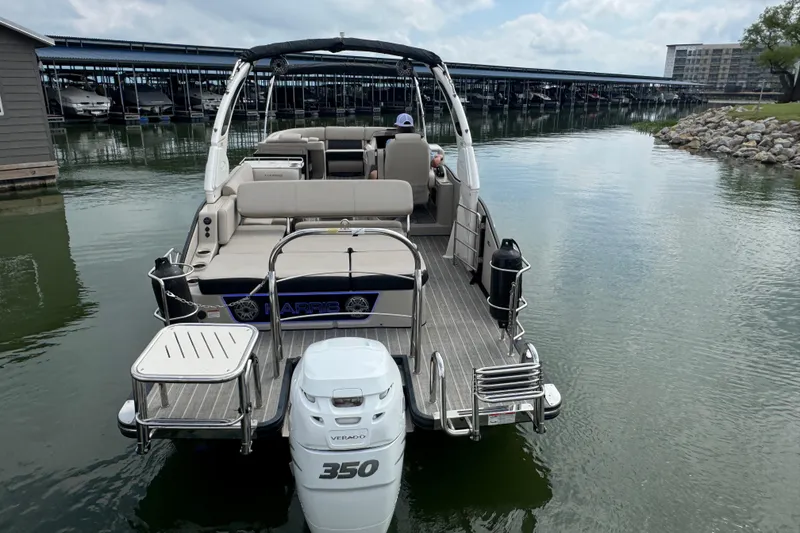Slide: The Image of 2023 Harris Grand Mariner 250 pontoon boat with Verado 350 engine on calm water. - 7