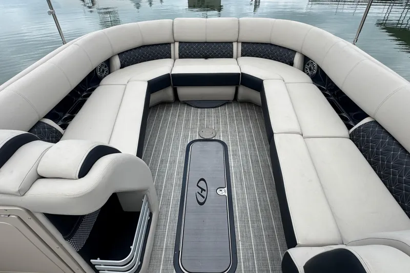 Slide: The Image of Luxurious seating on 2023 Harris Grand Mariner 250 pontoon boat, featuring elegant upholstery and spacious layout. - 8