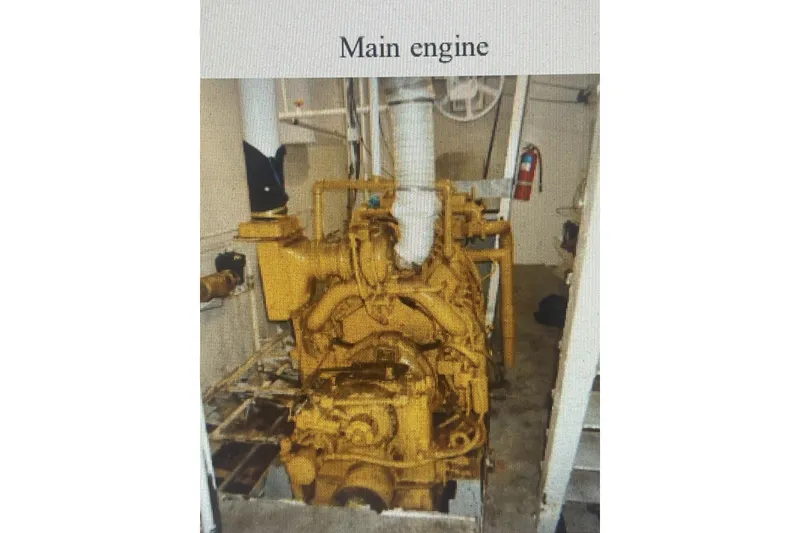 Slide: The Image of Main engine of 1984 Commercial Freezer Shrimp Trawler, yellow machinery in engine room. - 3