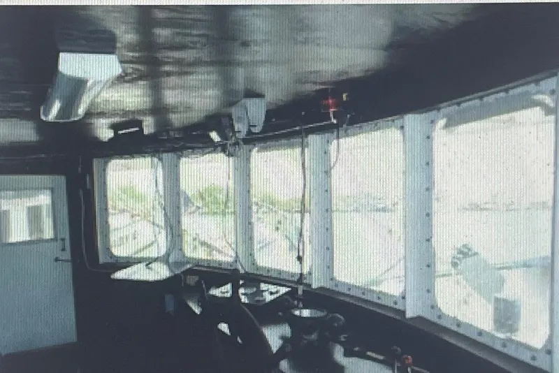 Slide: The Image of Interior view of a 1984 Commercial Freezer Shrimp Trawler's control room with large windows. - 5