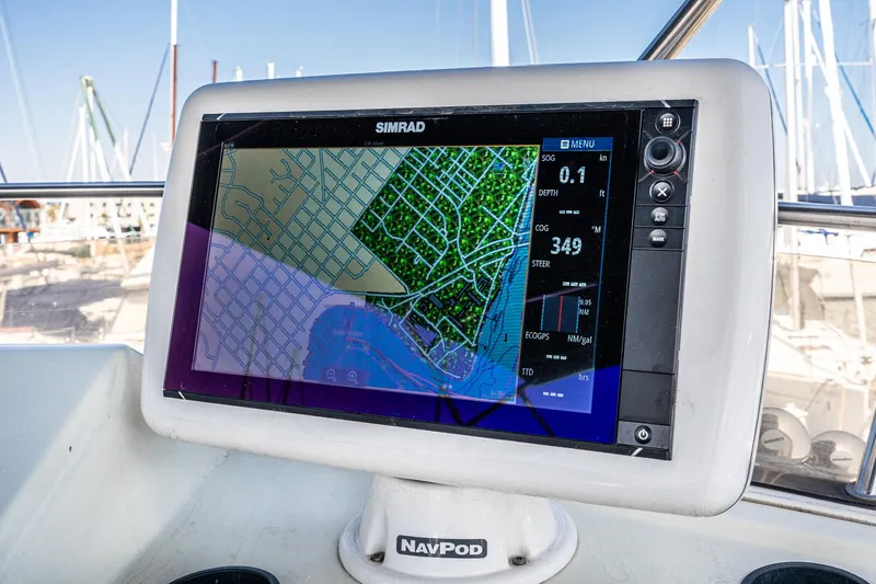 Slide: The Image of Simrad navigation display on 1992 Bayliner 4388 yacht, showing nautical map and data. - 15