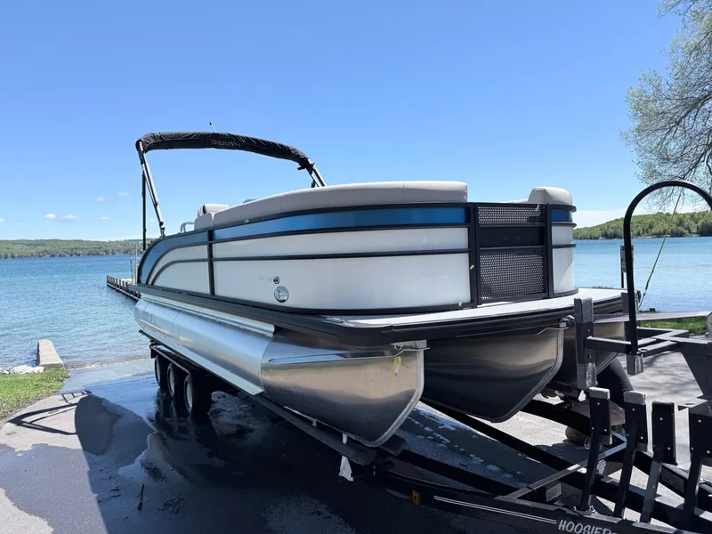 The Image of 2026 Harris Cruiser 230 pontoon boat on trailer by lakeside. - 8