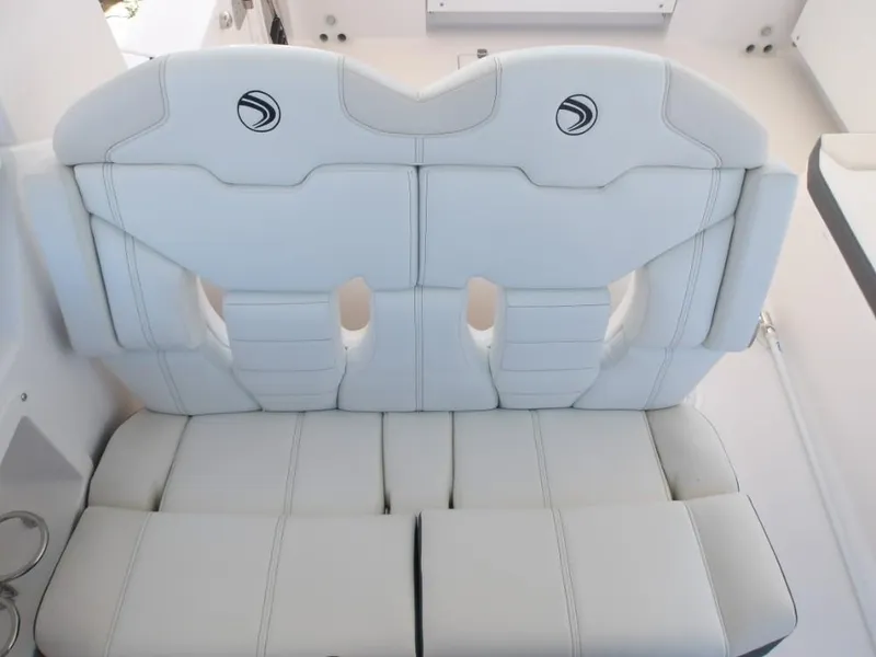 Slide: The Image of White leather seating on 2025 Edgewater 262 CX boat, featuring modern design and stitching. - 28