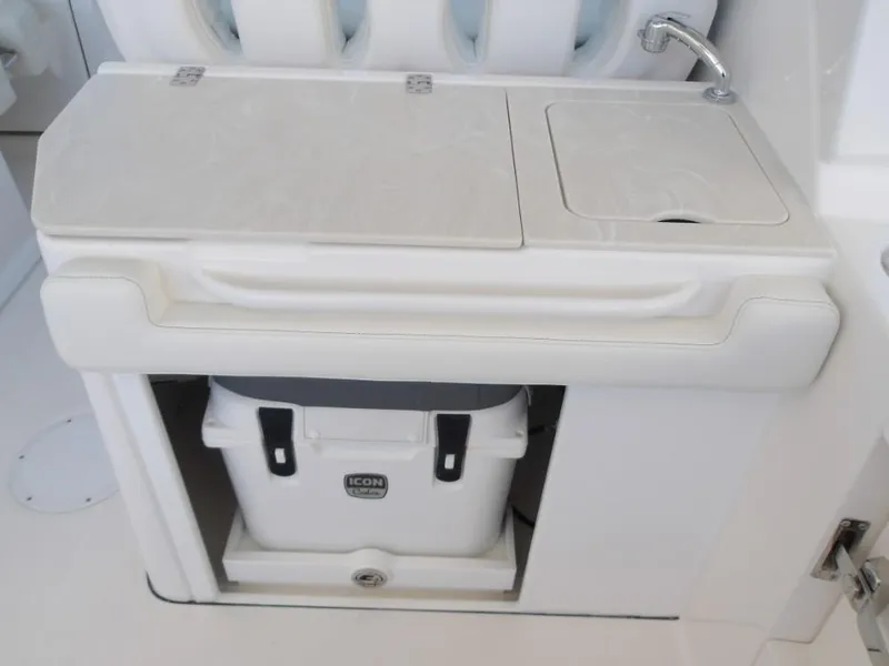 Slide: The Image of 2025 Edgewater 262 CX boat interior with sink and storage compartment. - 31