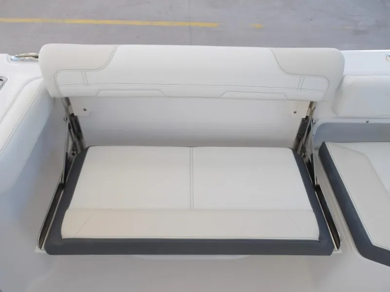 Slide: The Image of 2025 Edgewater 262 CX boat seat with white and gray upholstery. - 33