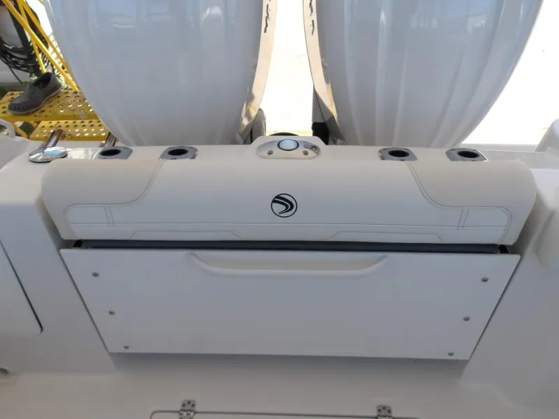 Slide: The Image of 2025 Edgewater 262 CX boat interior with storage compartment and seating. - 36