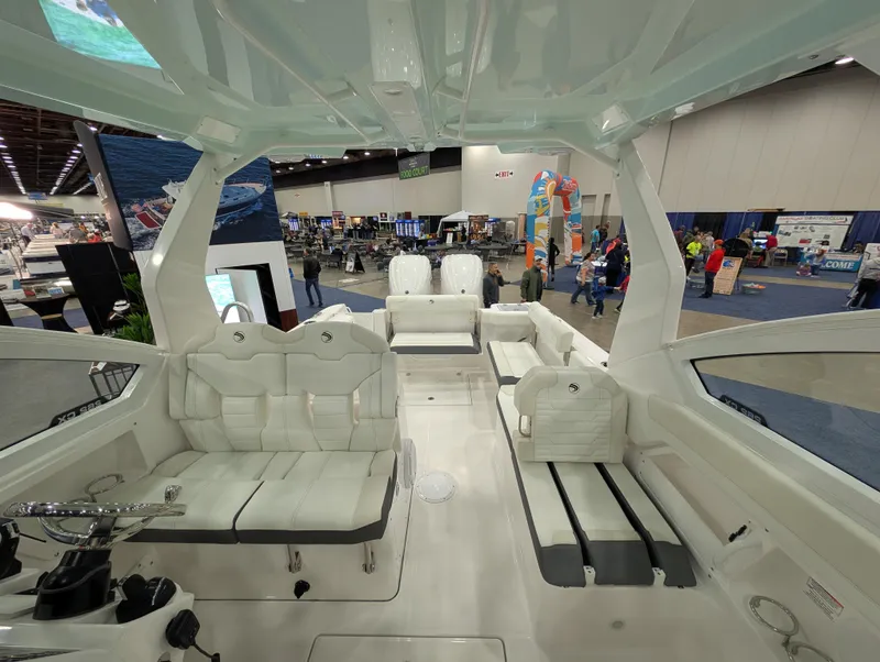 Slide: The Image of Interior view of 2025 Edgewater 262 CX boat at an indoor exhibition. - 6