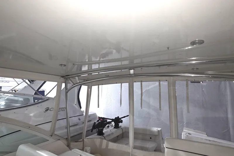 Slide: The Image of Interior view of a 2005 Tiara 290 Coronet boat with seating and controls. - 14