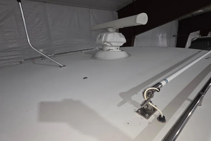 Slide: The Image of 2005 Tiara 290 Coronet boat radar and antenna setup in a covered storage area. - 25