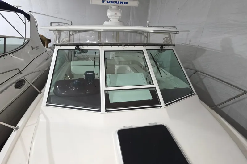 Slide: The Image of 2005 Tiara 290 Coronet boat with glass windshield and radar equipment in storage. - 26
