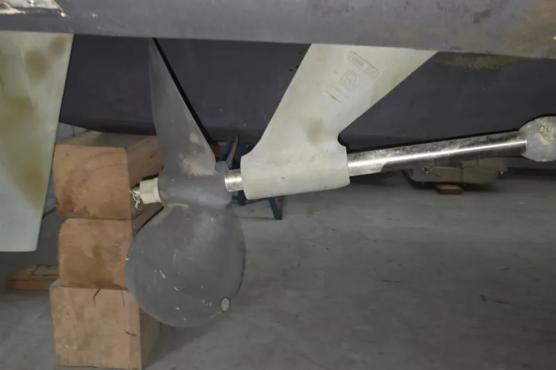 Slide: The Image of Propeller and shaft of a 2005 Tiara 290 Coronet boat in a workshop. - 29