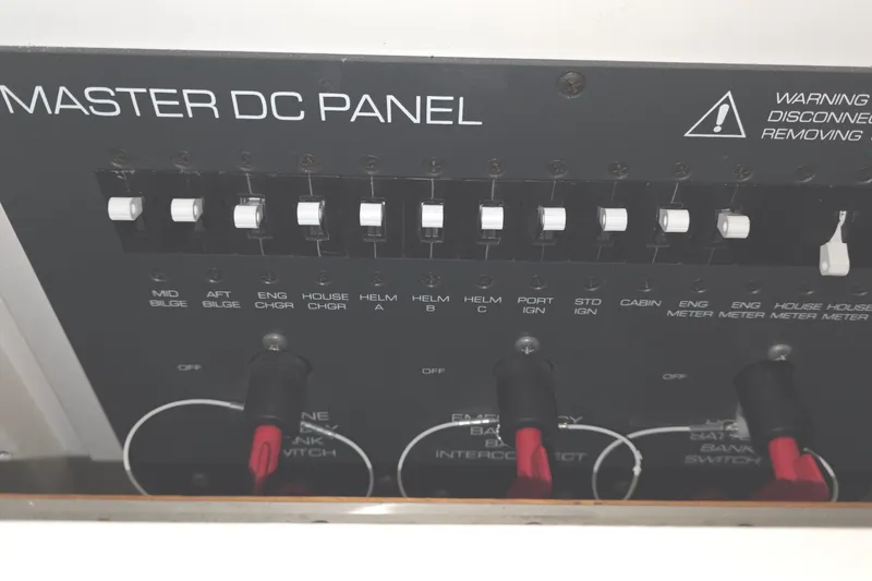 Slide: The Image of Master DC panel of a 2005 Tiara 290 Coronet boat with switches and warning label. - 30