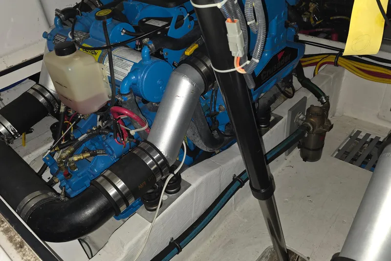 Slide: The Image of Engine compartment of a 2005 Tiara 290 Coronet boat, featuring a Crusader engine. - 32