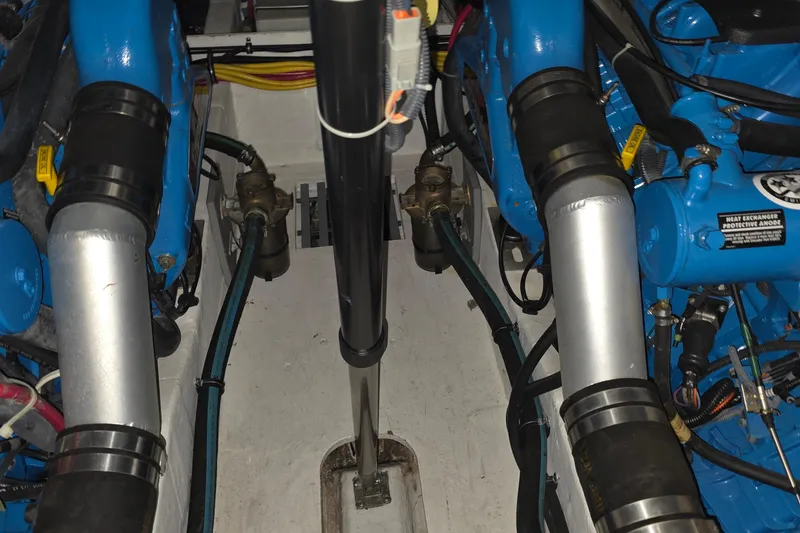 Slide: The Image of Engine compartment of a 2005 Tiara 290 Coronet boat, showcasing mechanical components. - 34