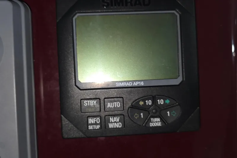 Slide: The Image of Simrad AP16 autopilot control panel on a 2005 Tiara 290 Coronet boat. - 6