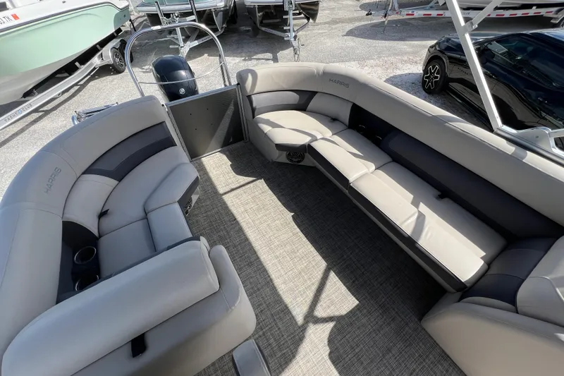 Slide: The Image of 2023 Harris Cruiser 230 pontoon boat interior with plush seating and modern design. - 11