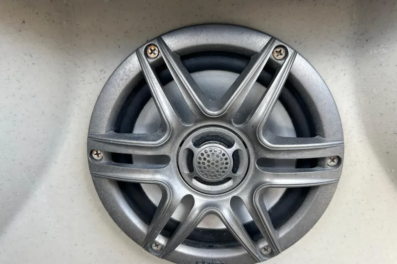 Slide: The Image of Close-up of a speaker grille on a 2023 Harris Cruiser 230 boat. - 19