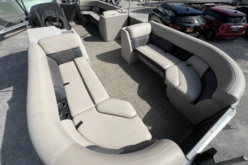 Slide: The Image of 2023 Harris Cruiser 230 pontoon boat interior with spacious seating and modern design. - 9