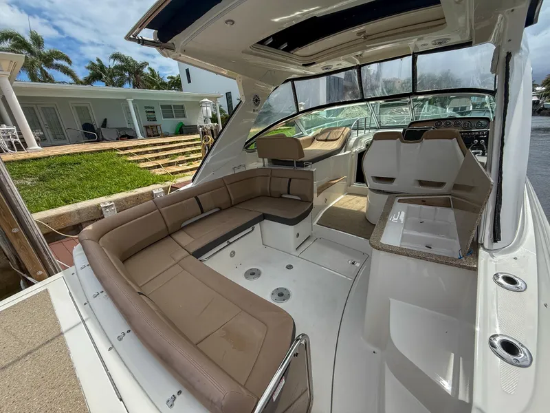 Slide: The Image of 2016 Sea Ray 350 Sundancer interior with spacious seating and modern design. - 6