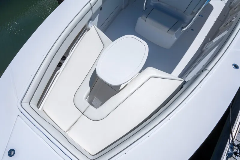 Slide: The Image of 2013 Jupiter 34 FS boat interior with white seating and table. - 17