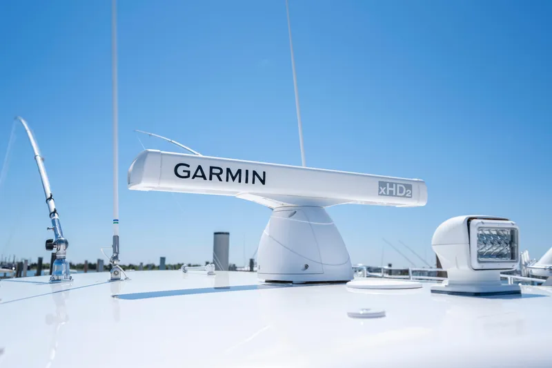 Slide: The Image of Garmin xHD2 radar on 2013 Jupiter 34 FS boat under clear blue sky. - 23