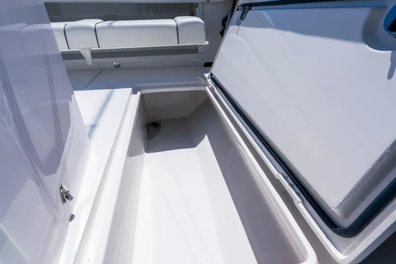 Slide: The Image of Open storage compartment on a 2013 Jupiter 34 FS boat, showcasing interior space. - 25