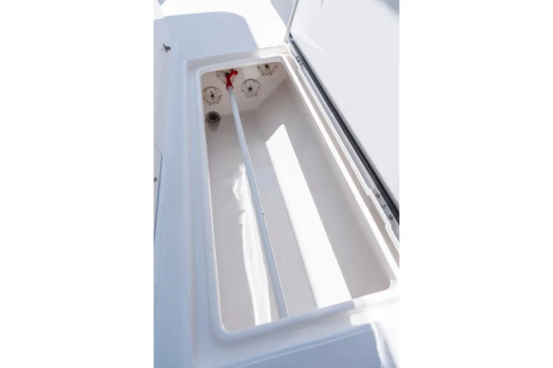 Slide: The Image of Open storage compartment on a 2013 Jupiter 34 FS boat, showcasing interior space. - 26