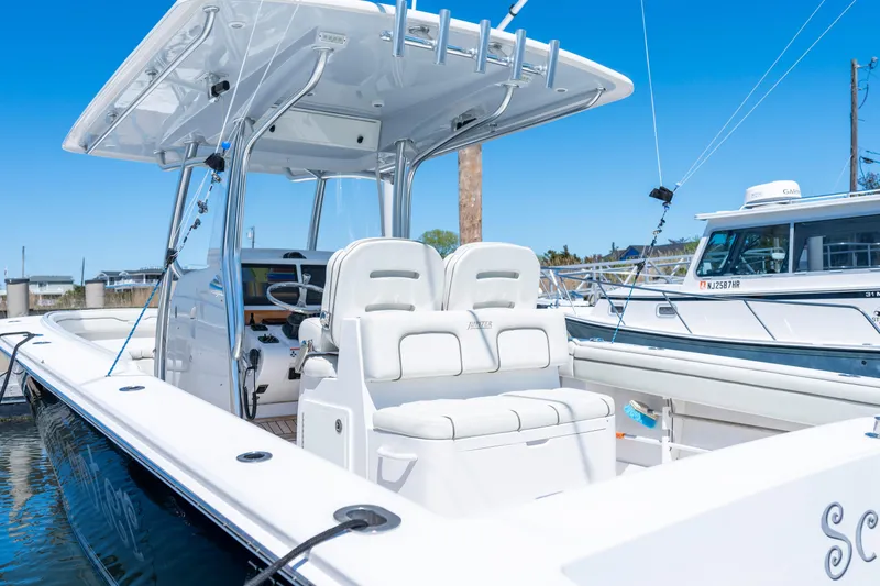 Slide: The Image of 2013 Jupiter 34 FS boat with sleek design and modern features docked at marina. - 8