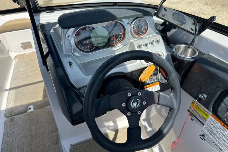 Slide: The Image of Steering wheel and dashboard of 2016 Scarab 255 H.O. Platinum boat. - 21