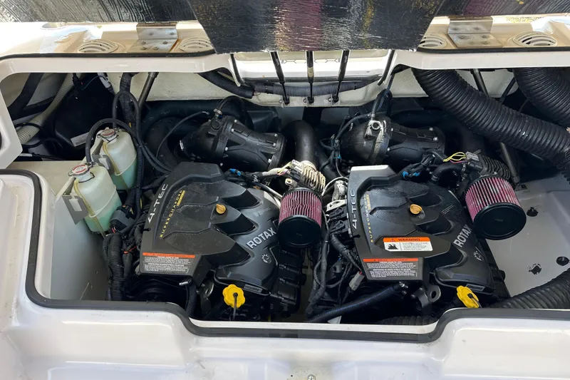 Slide: The Image of Engine compartment of a 2016 Scarab 255 H.O. Platinum boat, featuring dual Rotax engines. - 24