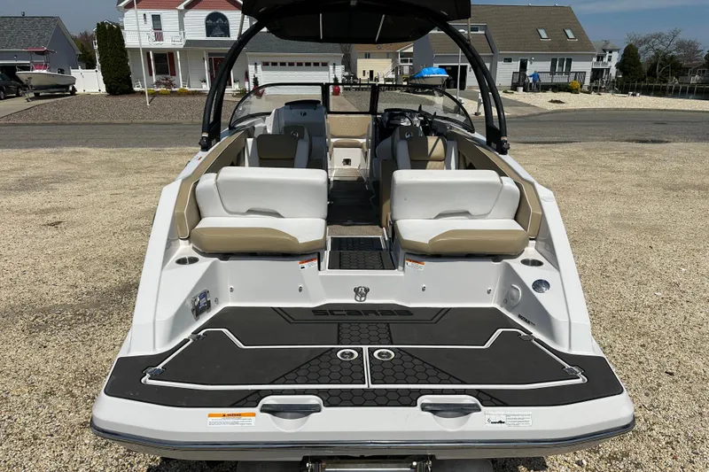 Slide: The Image of 2016 Scarab 255 H.O. Platinum boat, rear view, showcasing seating and deck design. - 6