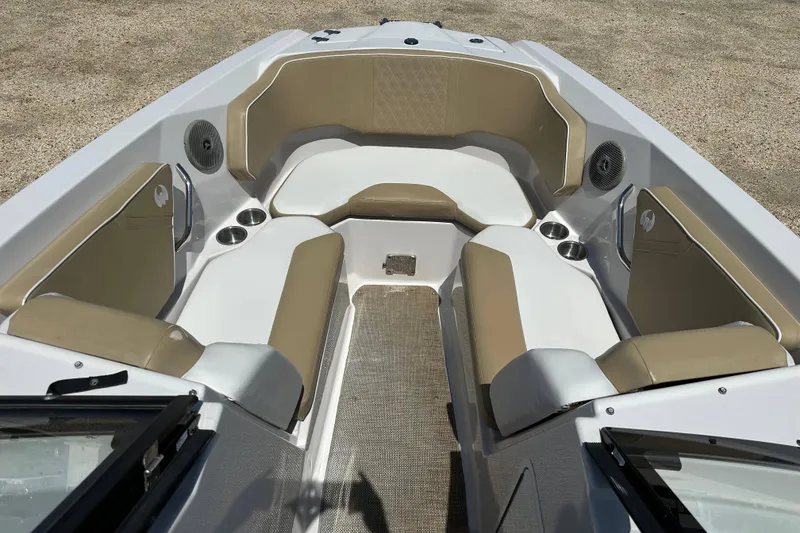 Slide: The Image of 2016 Scarab 255 H.O. Platinum boat interior with beige seating and cup holders. - 8