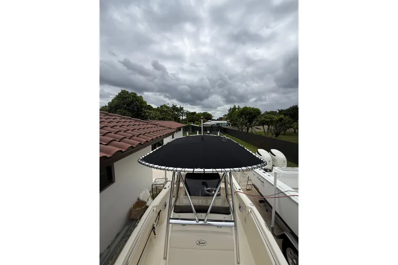 Slide: The Image of 2013 Scout 210 XSF boat under cloudy sky. - 14