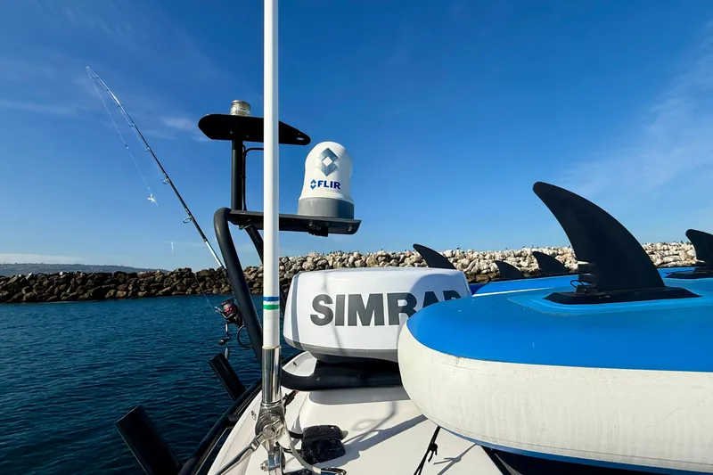 Slide: The Image of 2021 Axopar Brabus 28 Cabin with Simrad and FLIR equipment on a sunny day. - 16